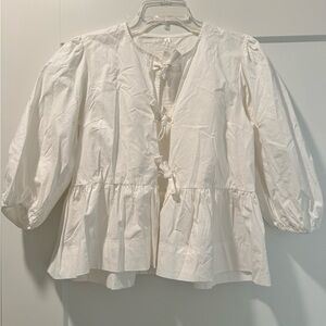 Tie blouse with ruffle detail